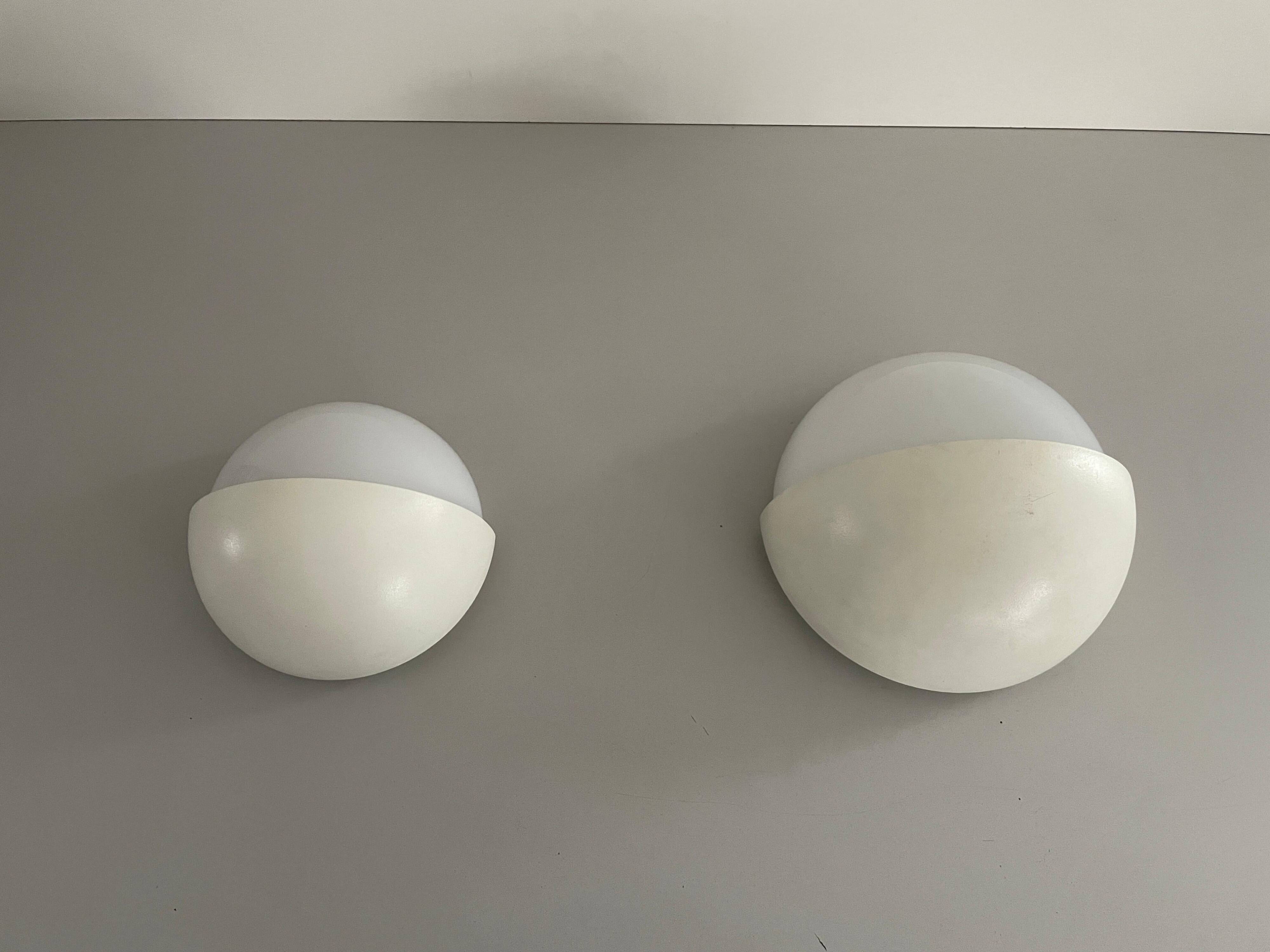 Round wall lights, small and large, in white metal by Bega, 1970s, Germany.