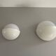 Round wall lights, small and large, in white metal by Bega, 1970s, Germany.