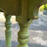 Old table with patinated green legs