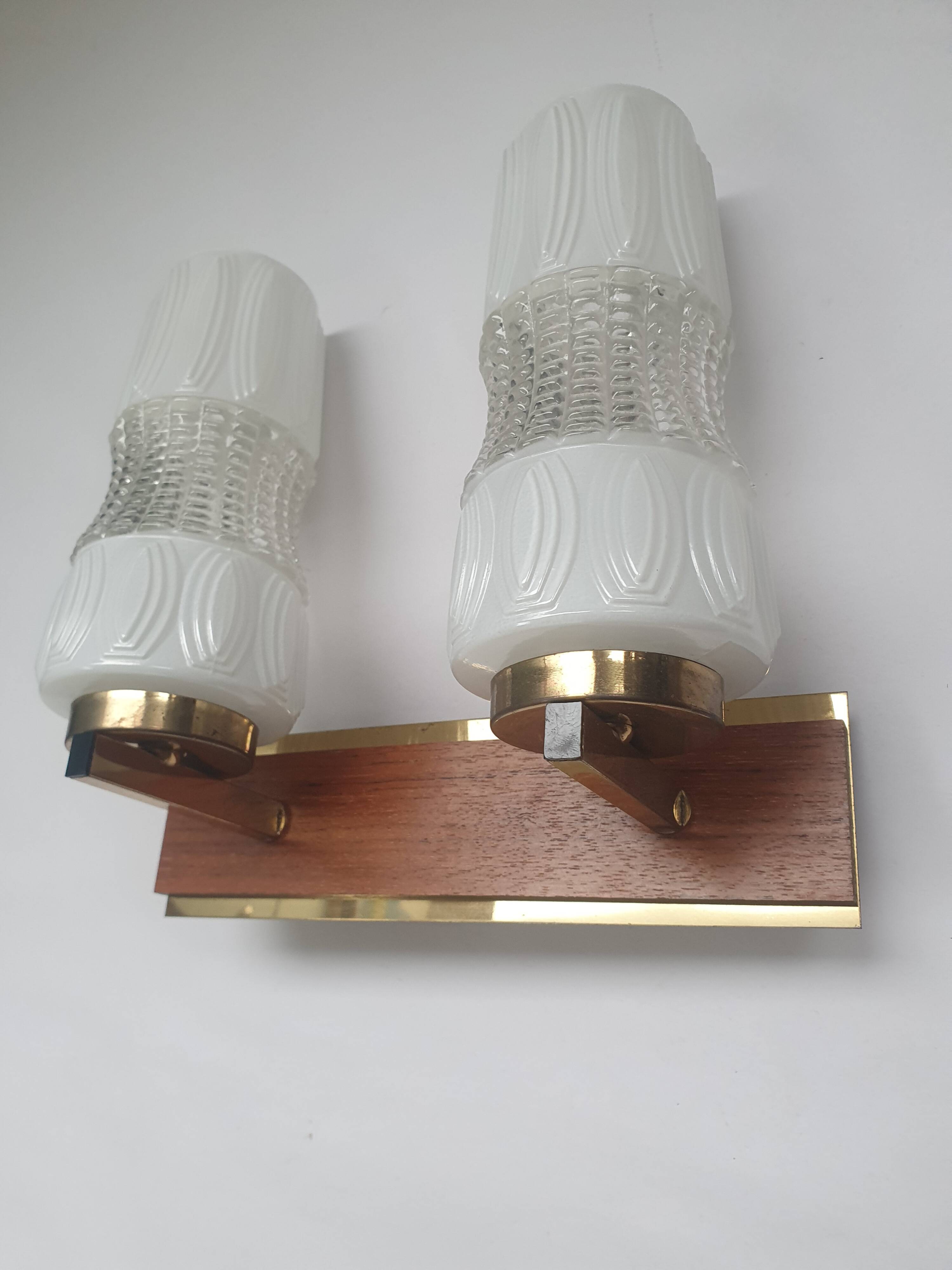 Vintage gold wall light on wooden stand