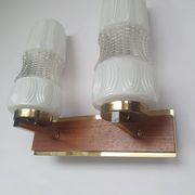 Vintage gold wall light on wooden stand