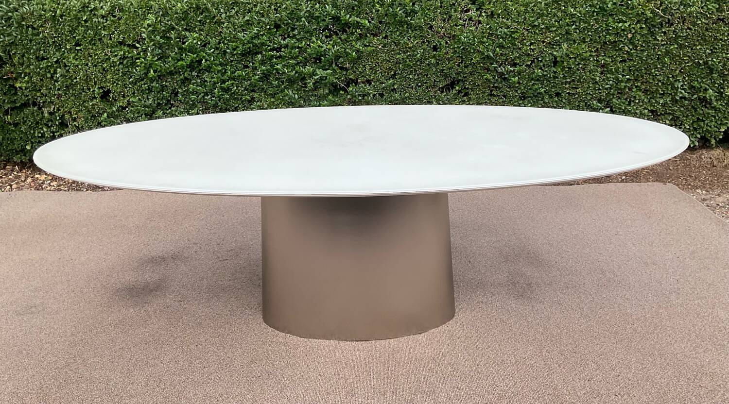 Oval designer dining table in frosted glass and brushed stainless steel