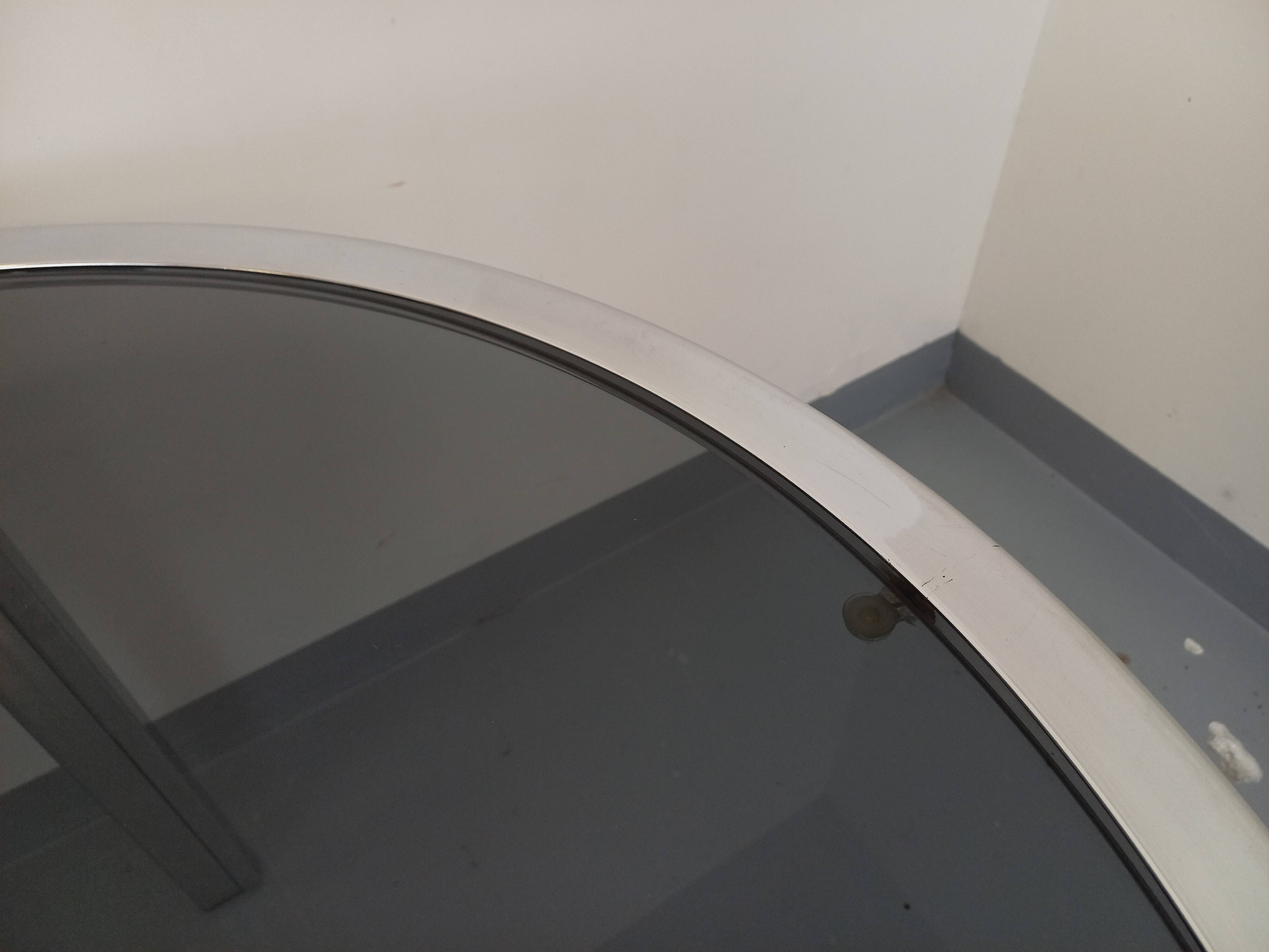 Vintage oval dining table in smoked glass and chrome metal, Space Age style.