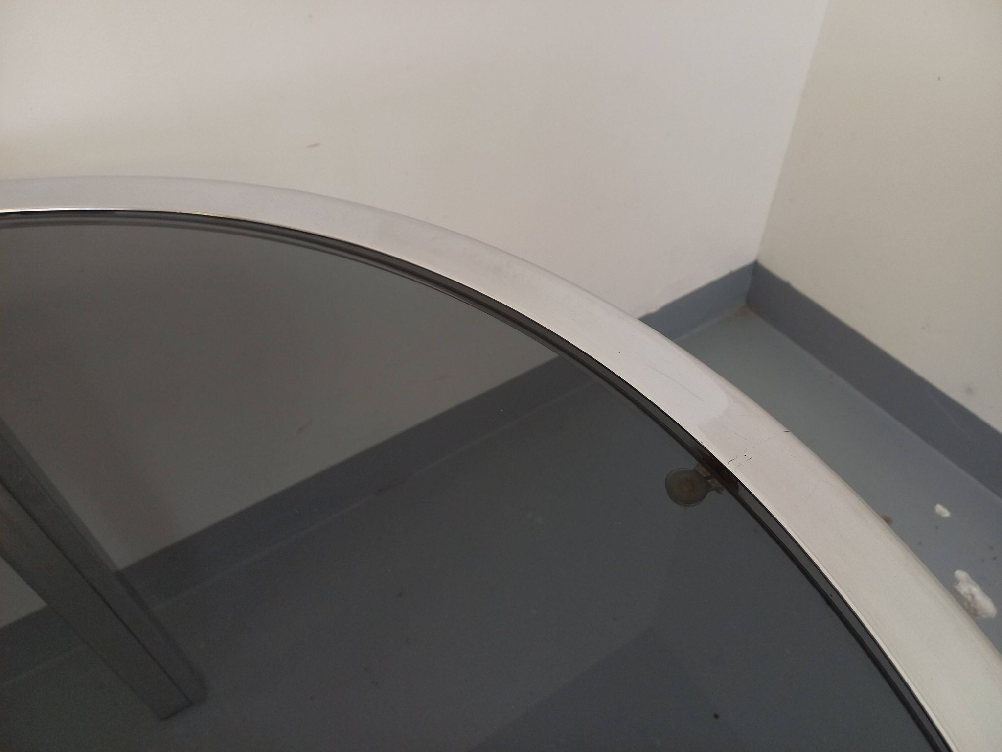 Vintage oval dining table in smoked glass and chrome metal, Space Age style.