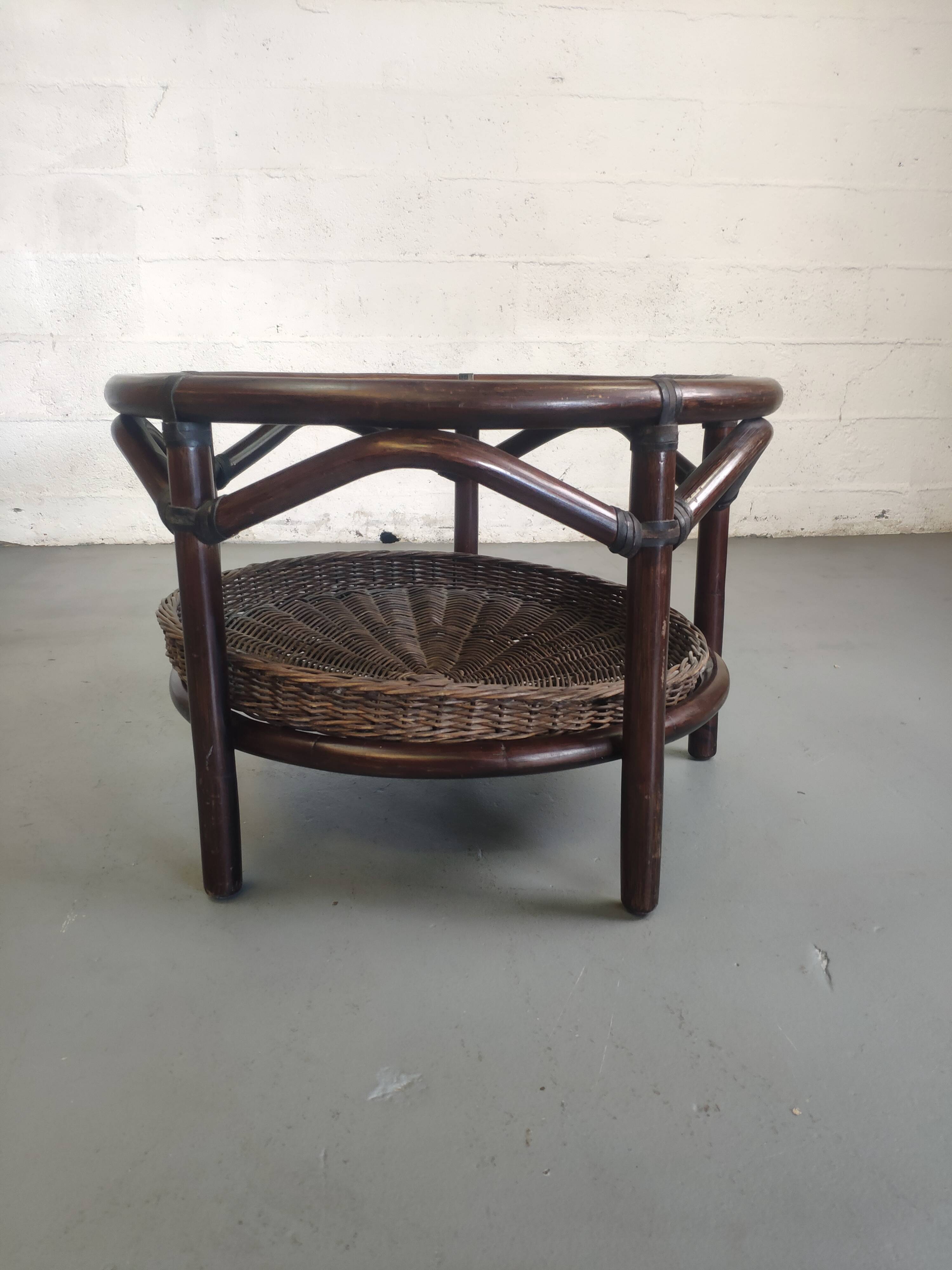 Vintage rattan coffee table with smoked glass top and rattan basket shelf