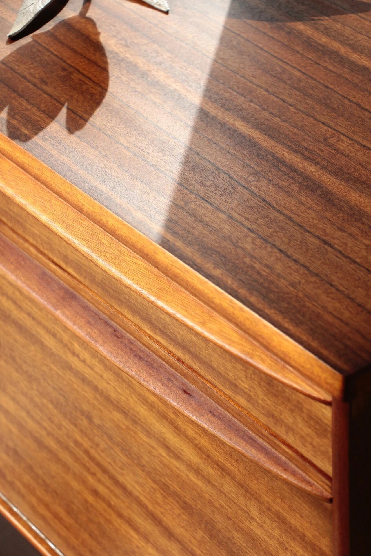 Vintage zebrano and walnut furniture from Morris of Glasgow.