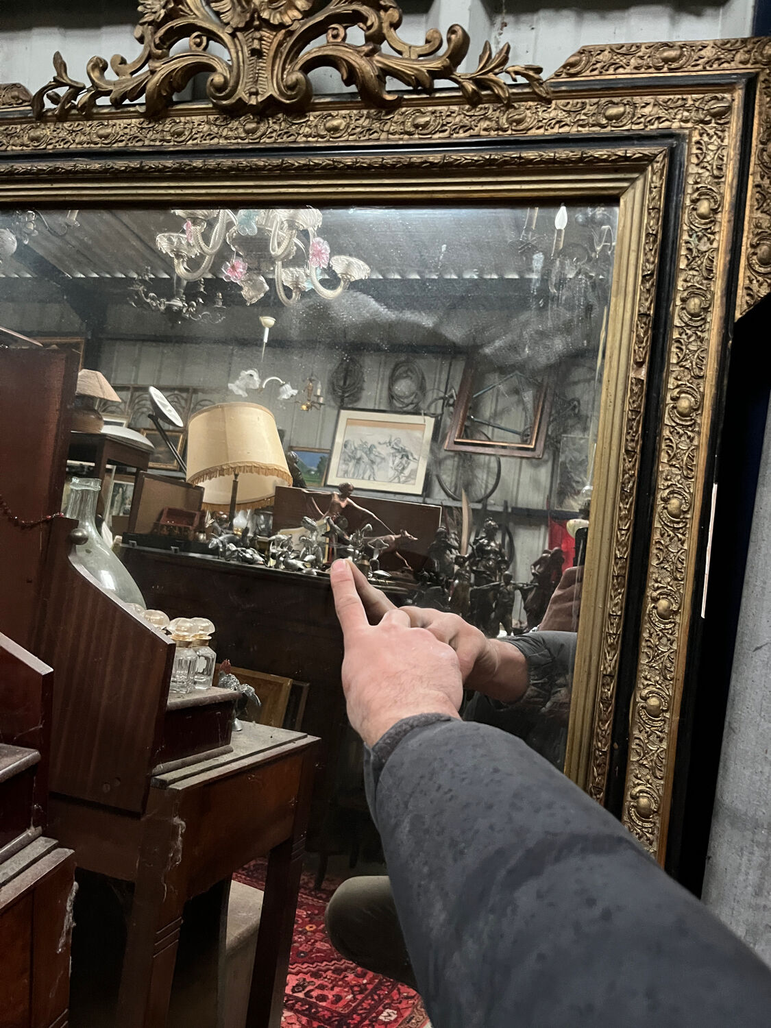 Large antique gilt mirror with scroll and shell decoration, 144 cm