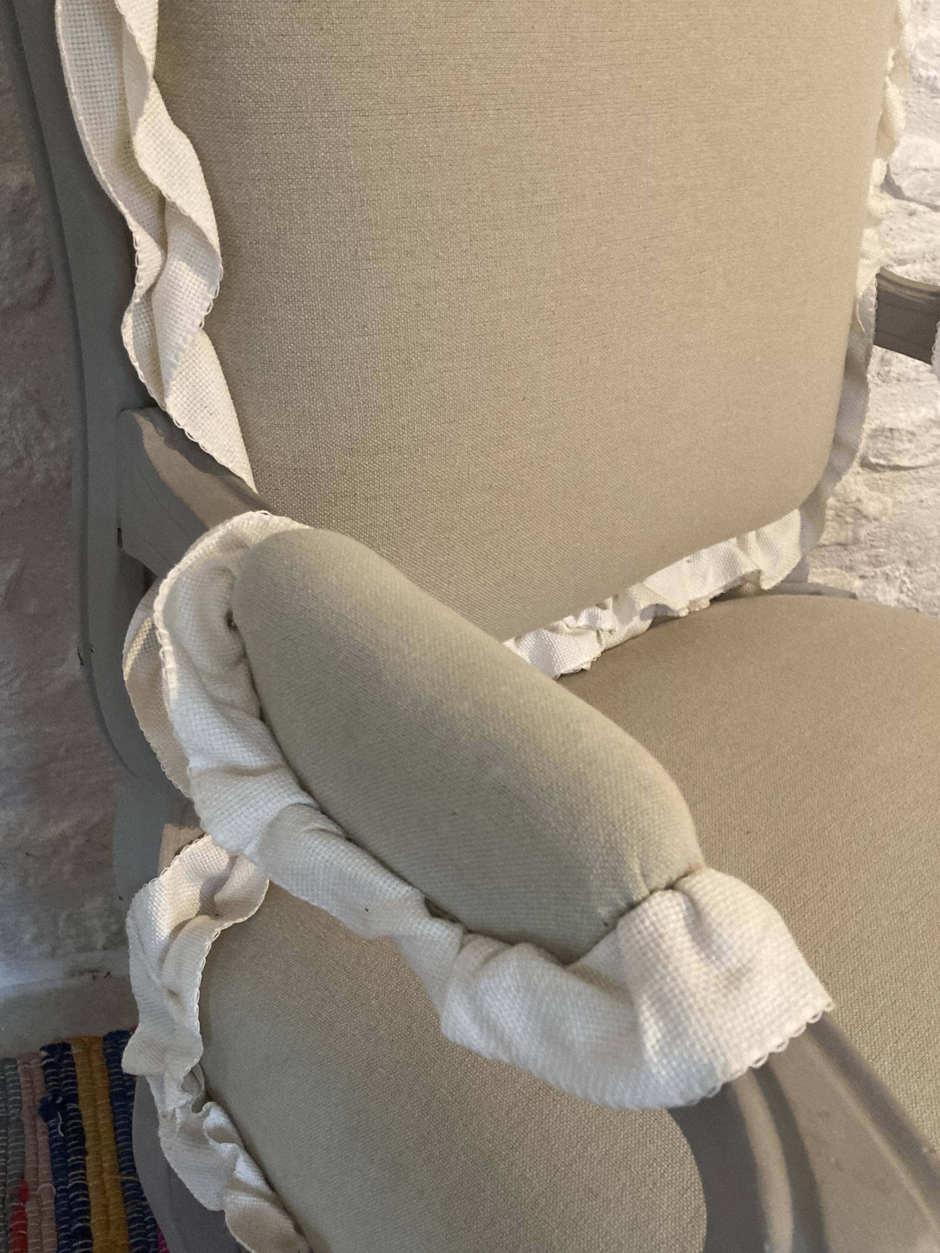 Frilly Regency style bergère armchair