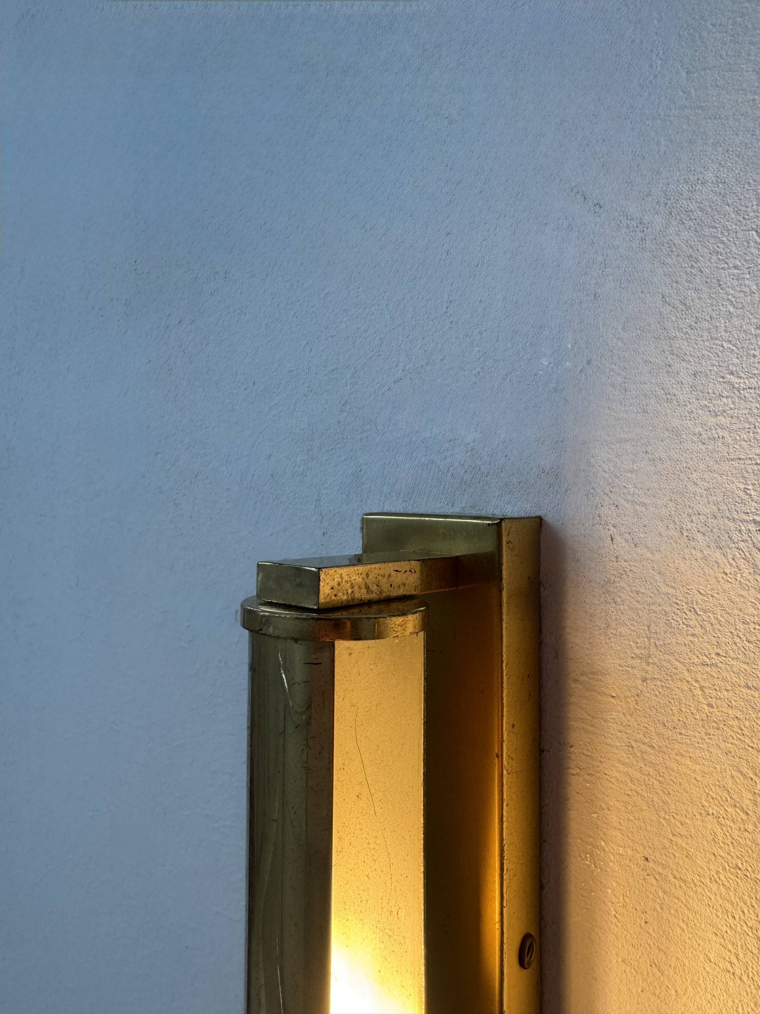Pair of vintage modernist adjustable wall lights, brass, France 1970.