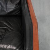 Black cowhide leather and wooden Art Deco design armchair