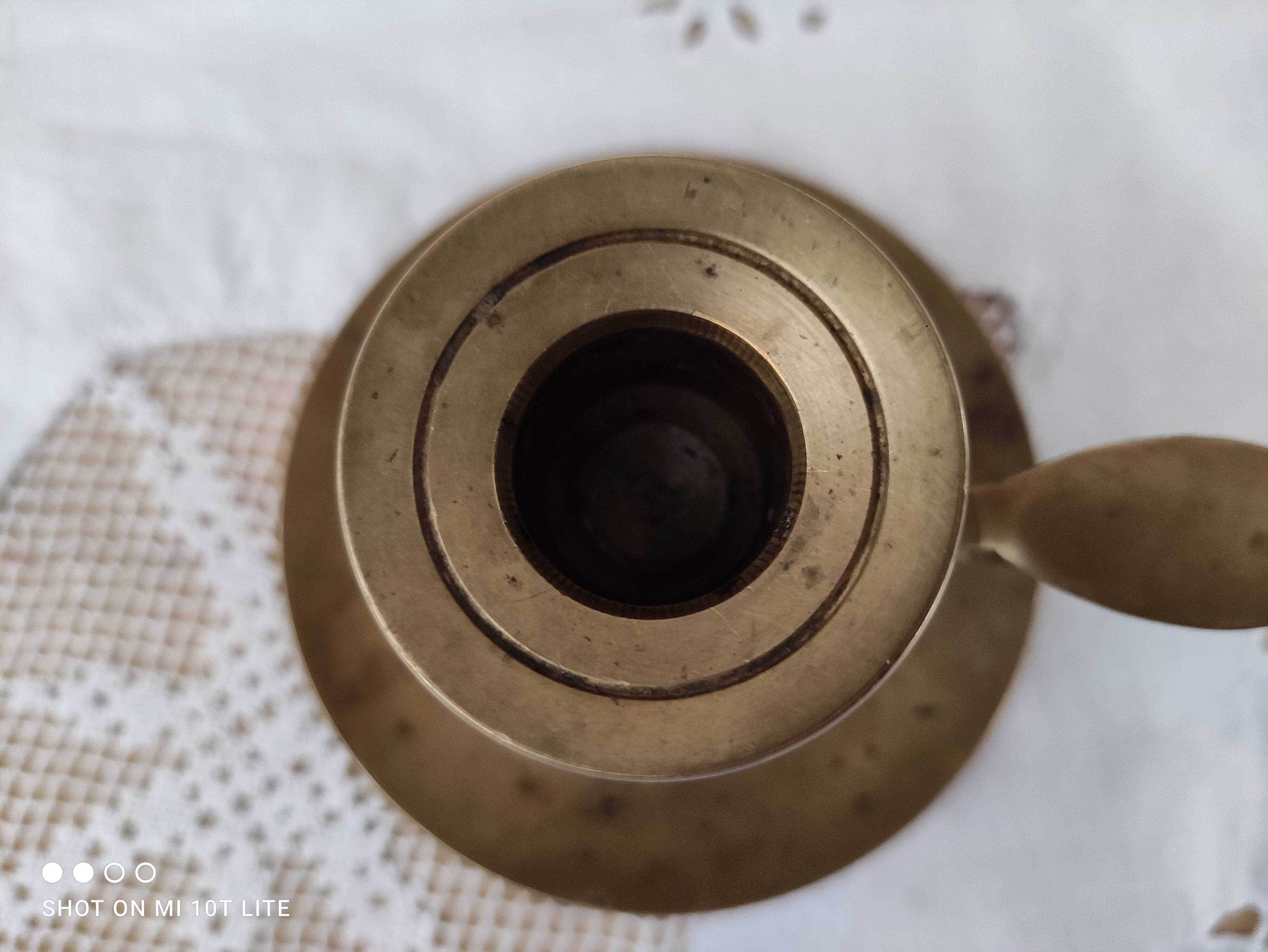 Hand candle holder called cellar rat in solid brass
