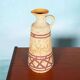 Vintage vase from the 60s, W-Germany footed vase in caramel yellow.