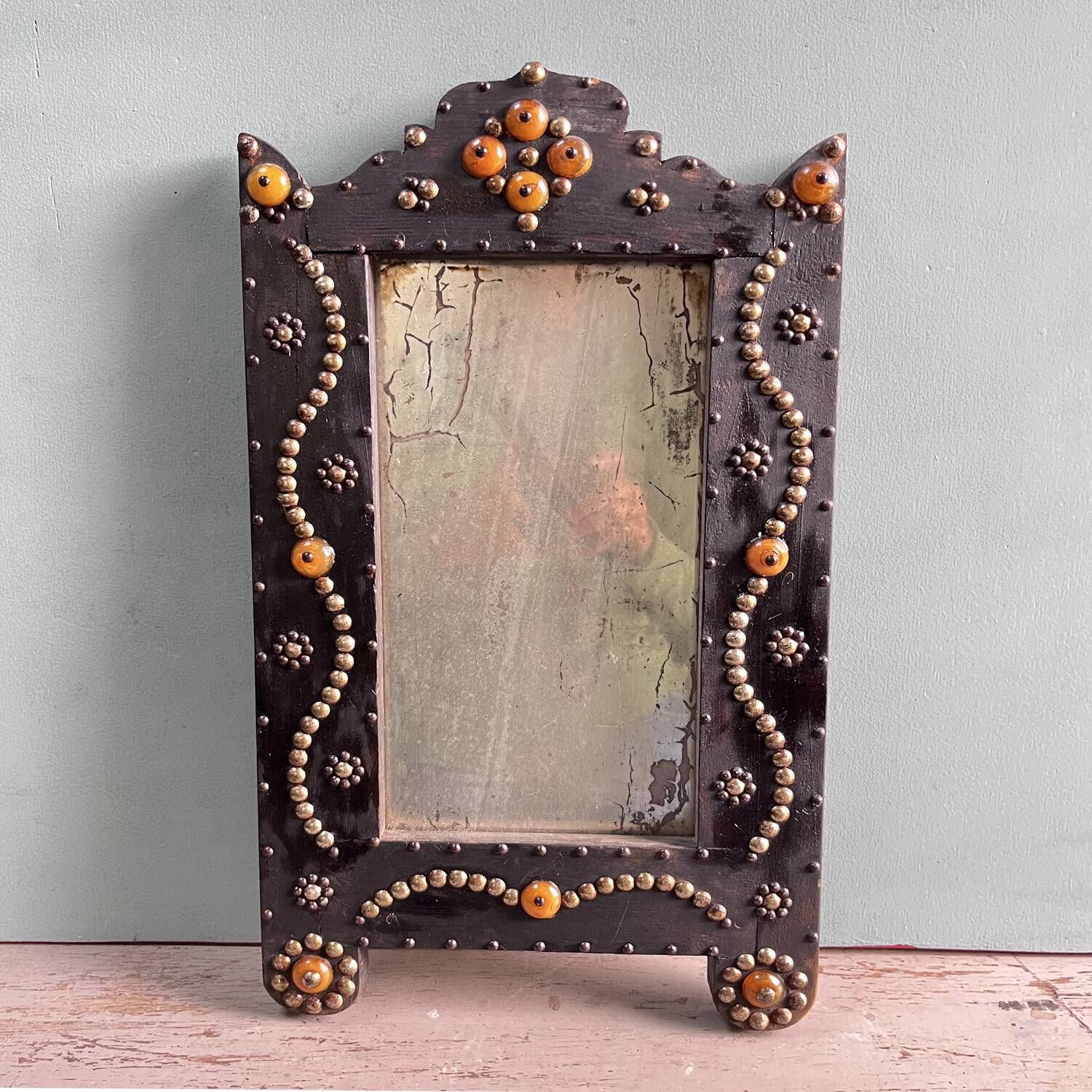 Antique wooden studded mirror