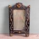 Antique wooden studded mirror