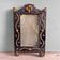 Antique wooden studded mirror