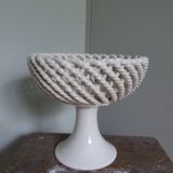 Cup on woven ceramic base with slip flowers