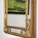 Grand miroir italien doré en bois à verre biseauté