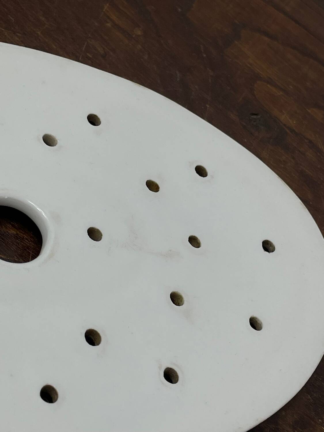 Old iron clay draining plate