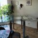High table with tempered glass and chrome base.