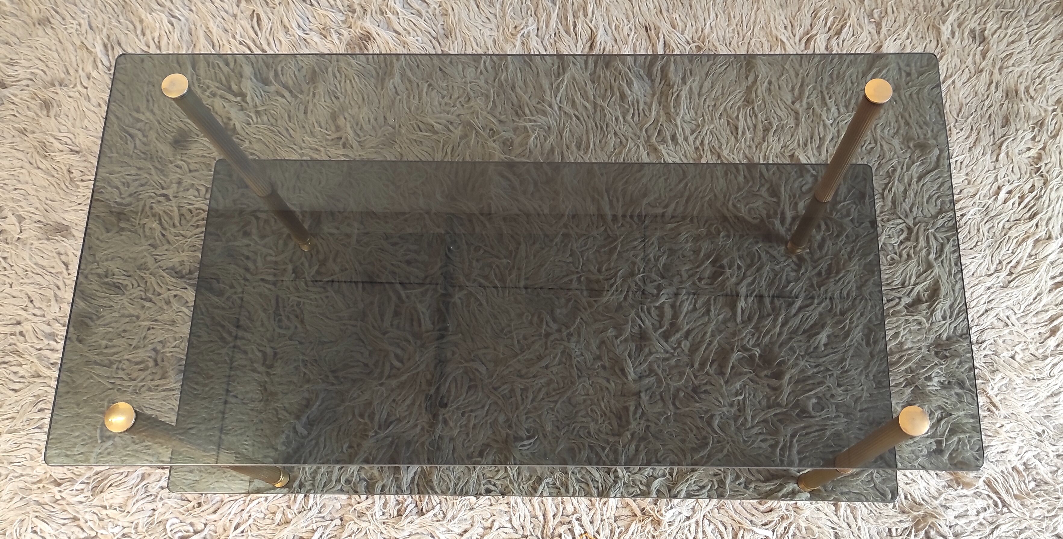 Coffee table in gilded metal and smoked glass – 60s