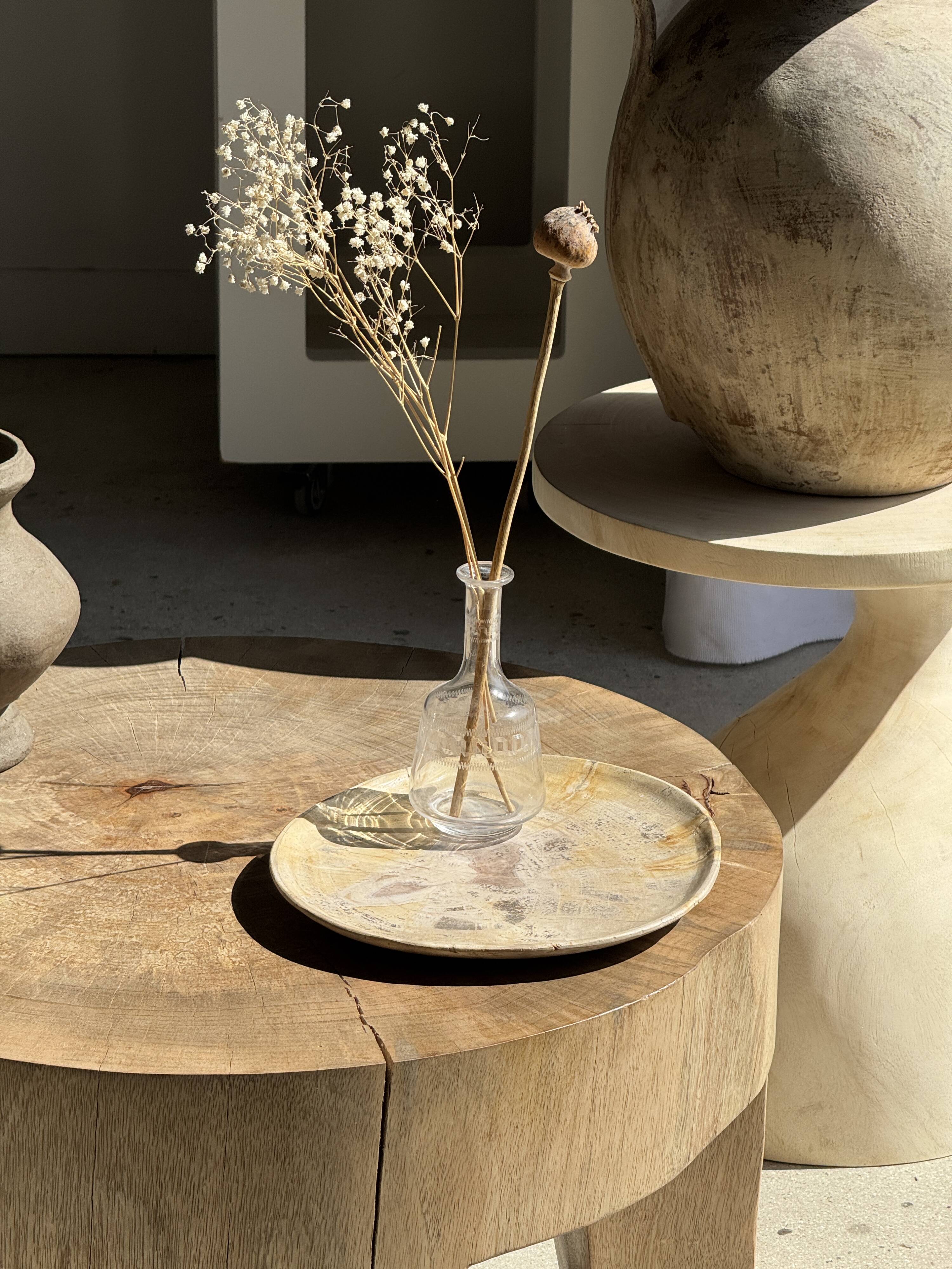 Petrified wood catchall or dish in beige with several grey spots in the centre.