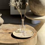Petrified wood catchall or dish in beige with several grey spots in the centre.