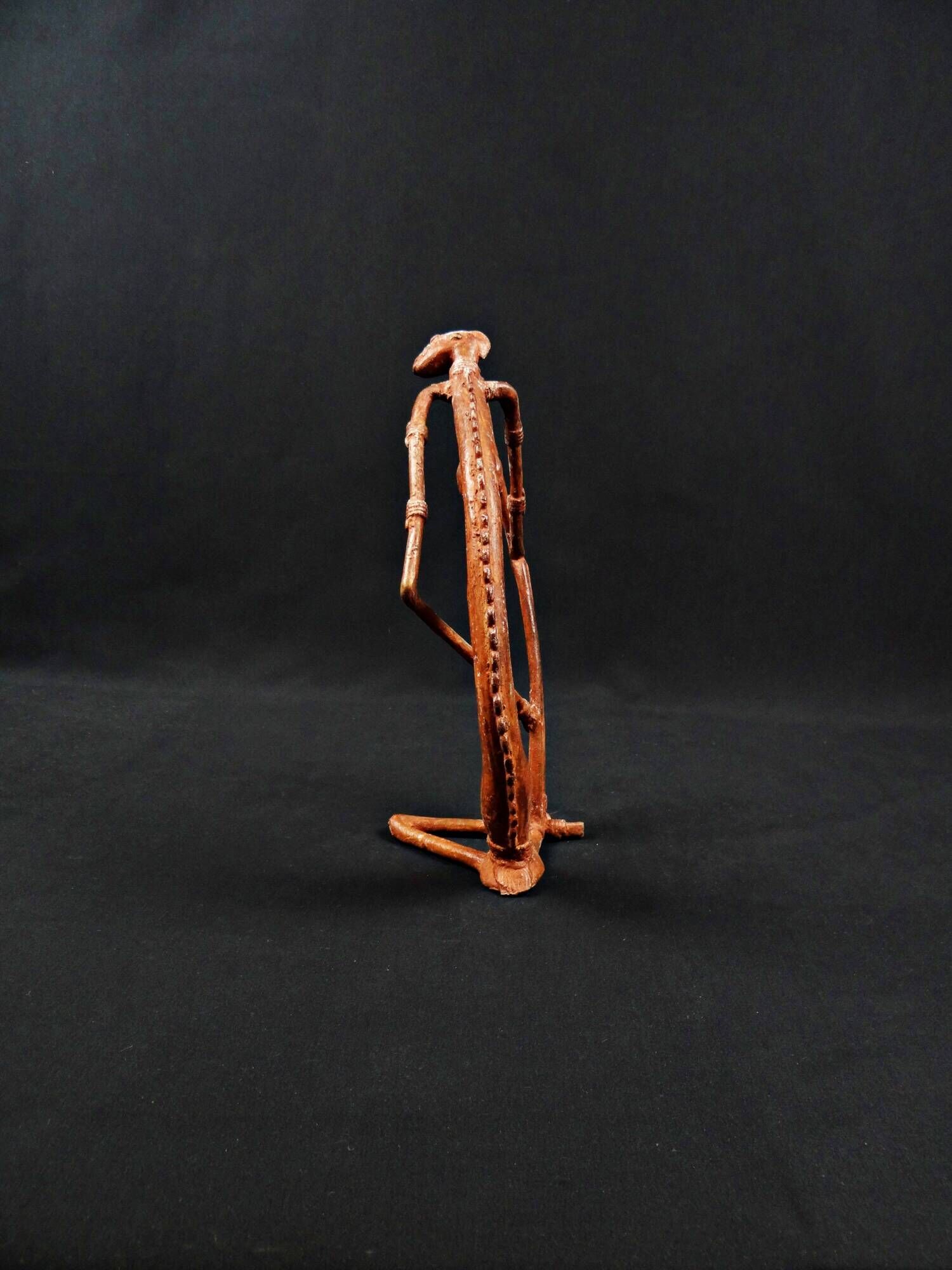 Dogon Nommo bronze statue with brown patina and red highlights, mid-20th century