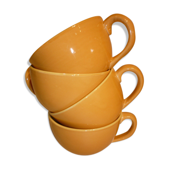 4 yellow and orange ceramic cups