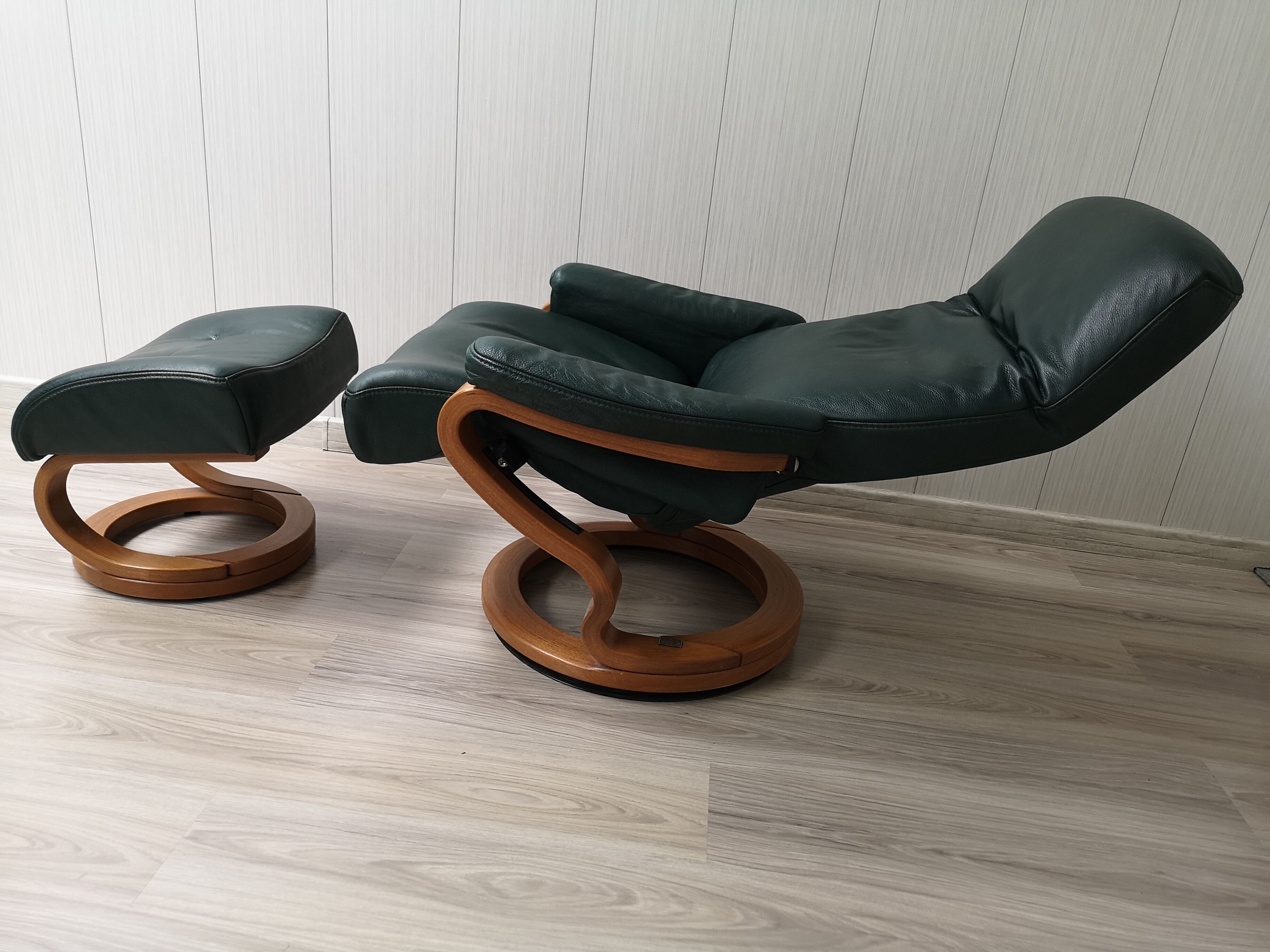 Mid - century leather armchair with footrest with relax function from himolla