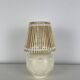 Vintage ceramic lamp with wicker and cotton shade.