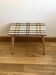 Small mosaic bedside table with tapered legs.