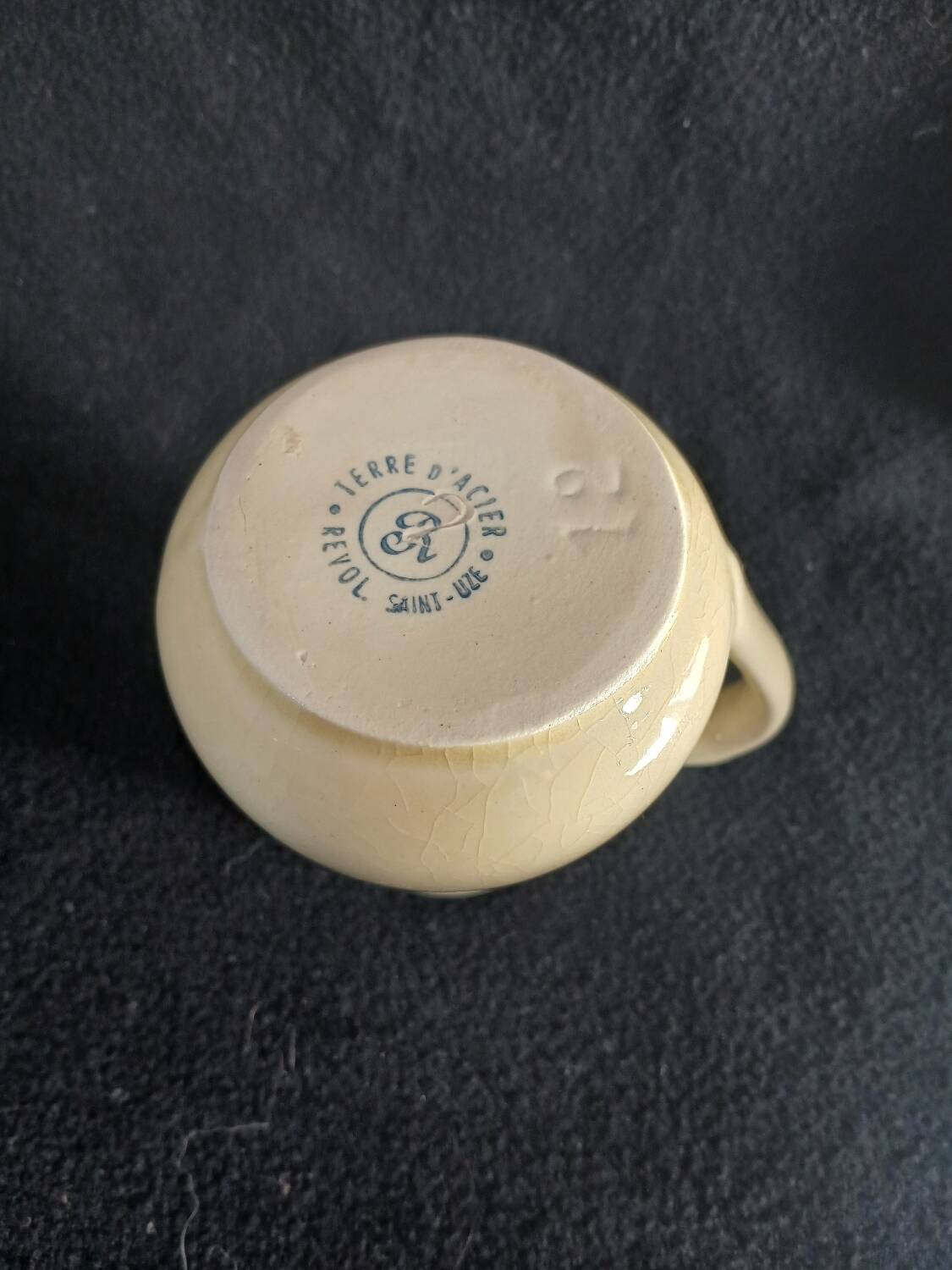 Old milk jug in steel clay