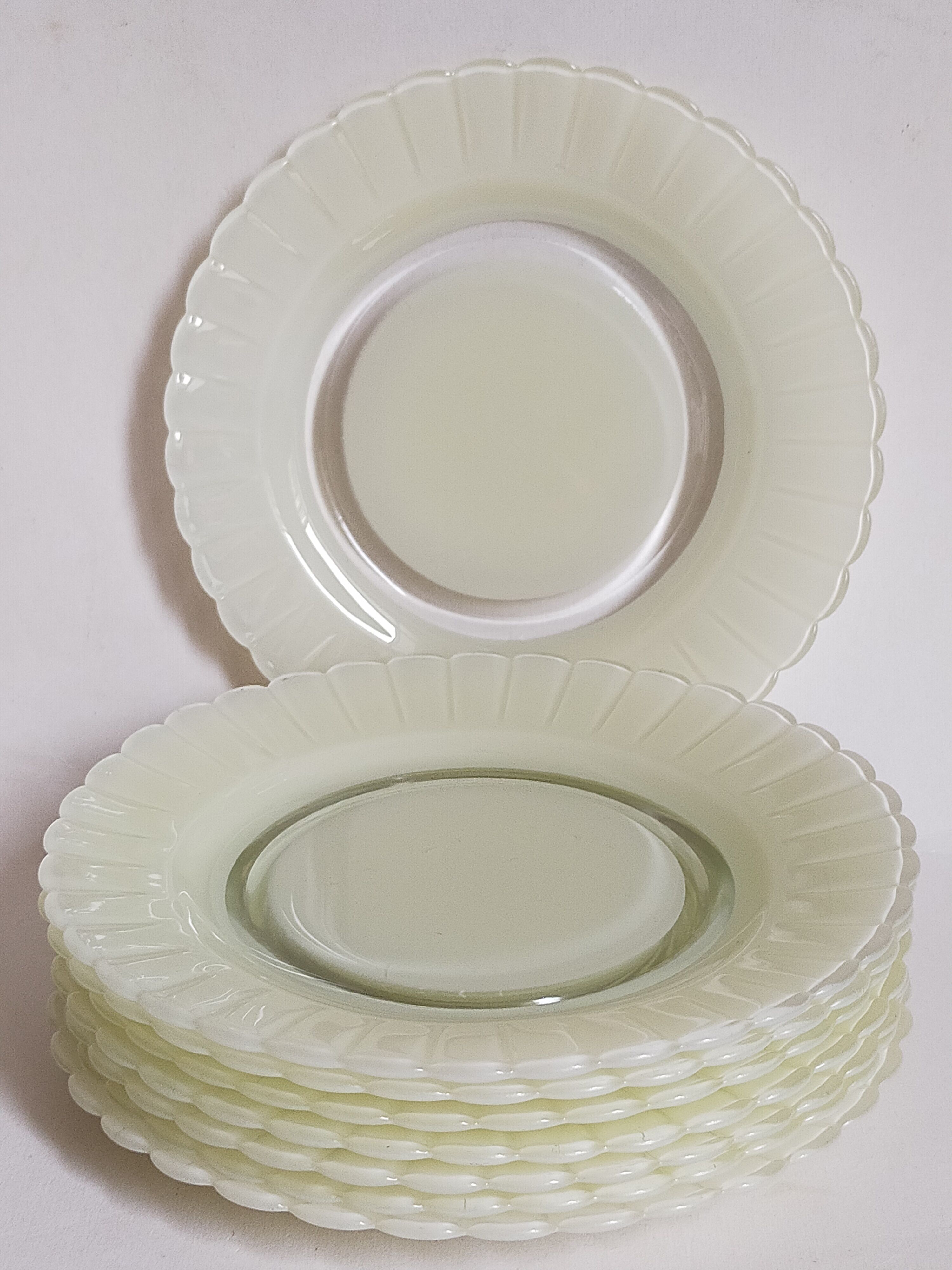 Eight Duralex dessert plates in 60s painted glass
