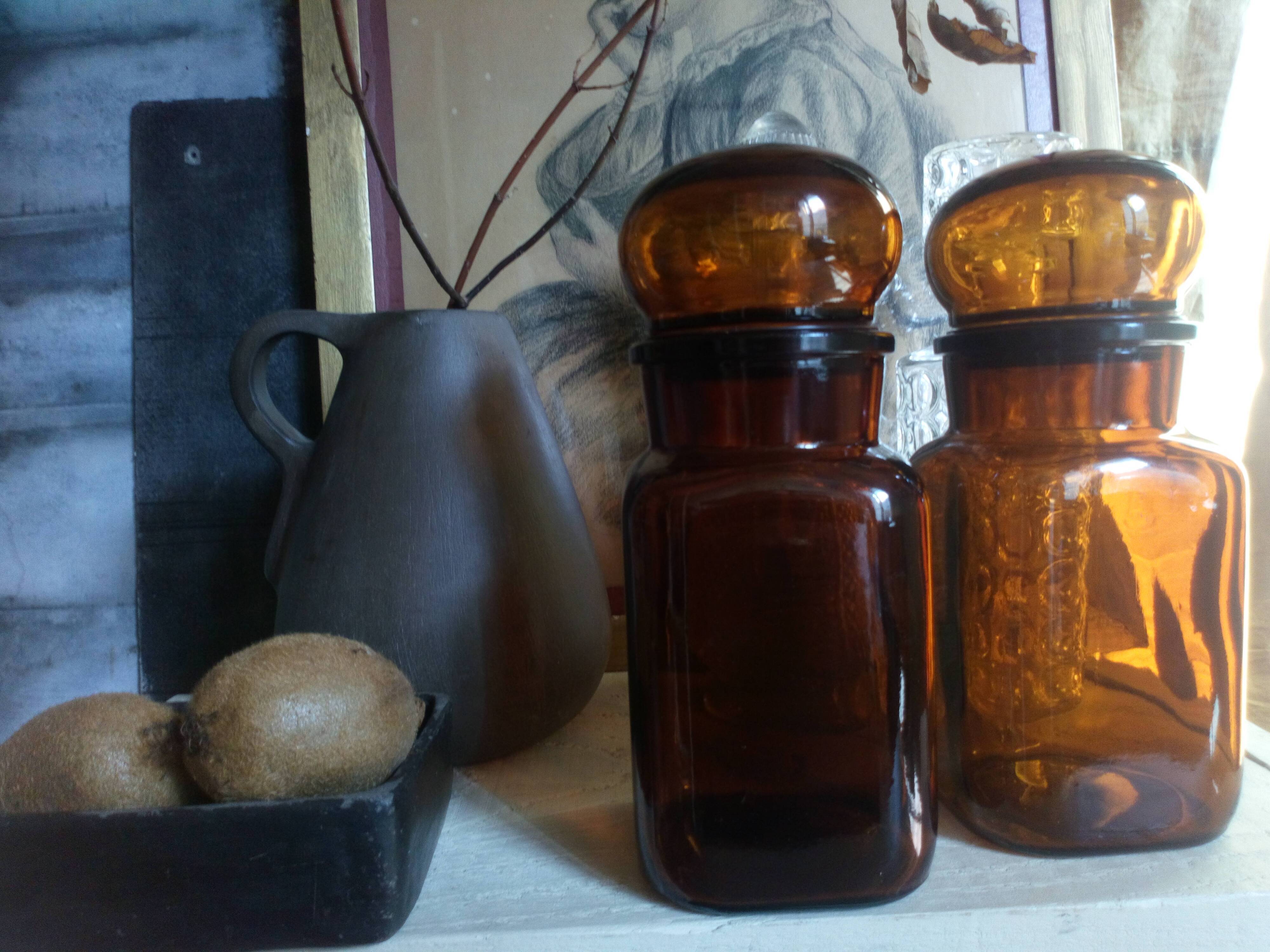 Duo of vintage apothecary bottles in amber glass
