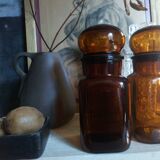 Duo of vintage apothecary bottles in amber glass