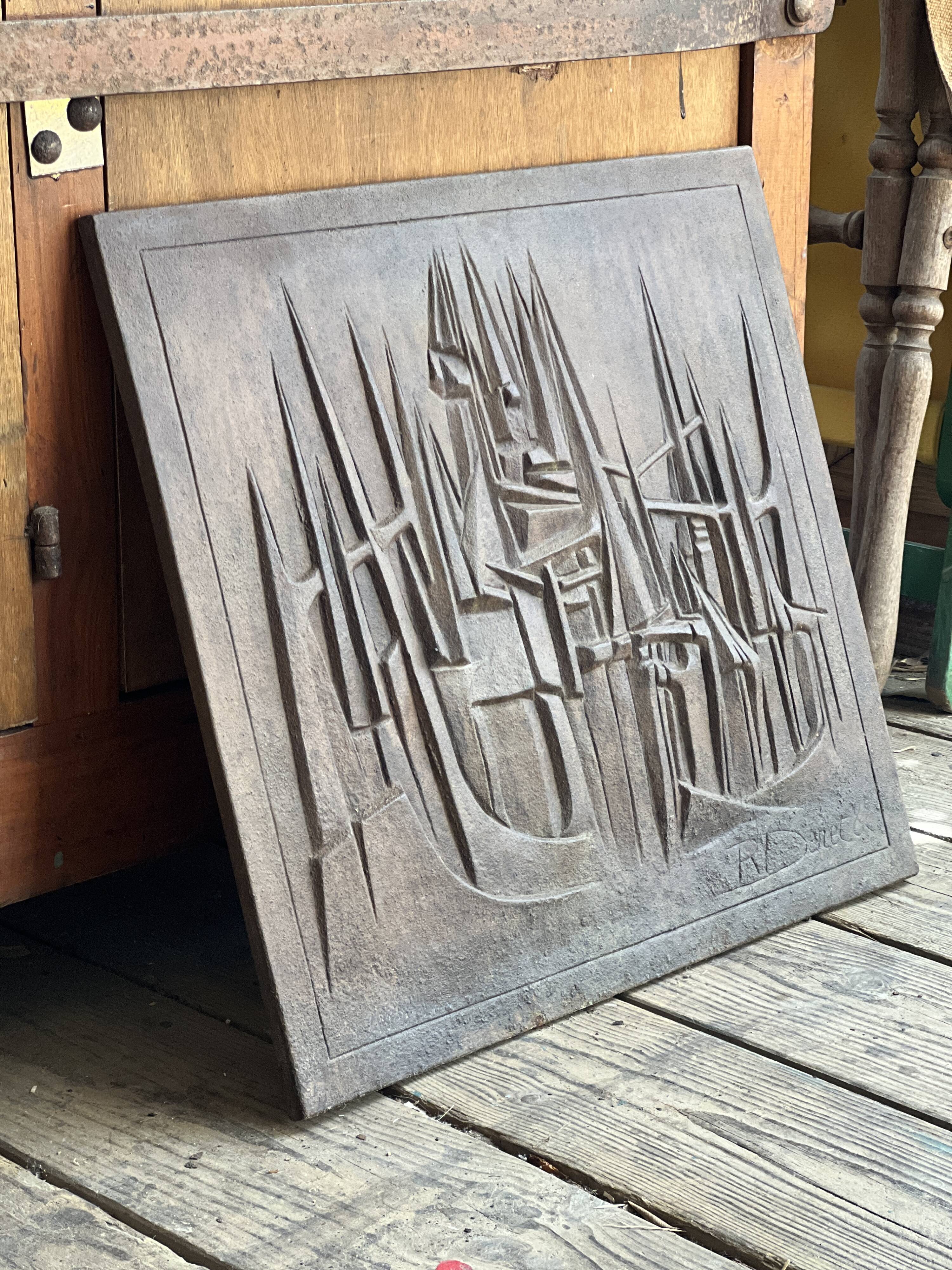 Cast iron plaque signed