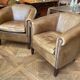 pair of camel leather club armchairs