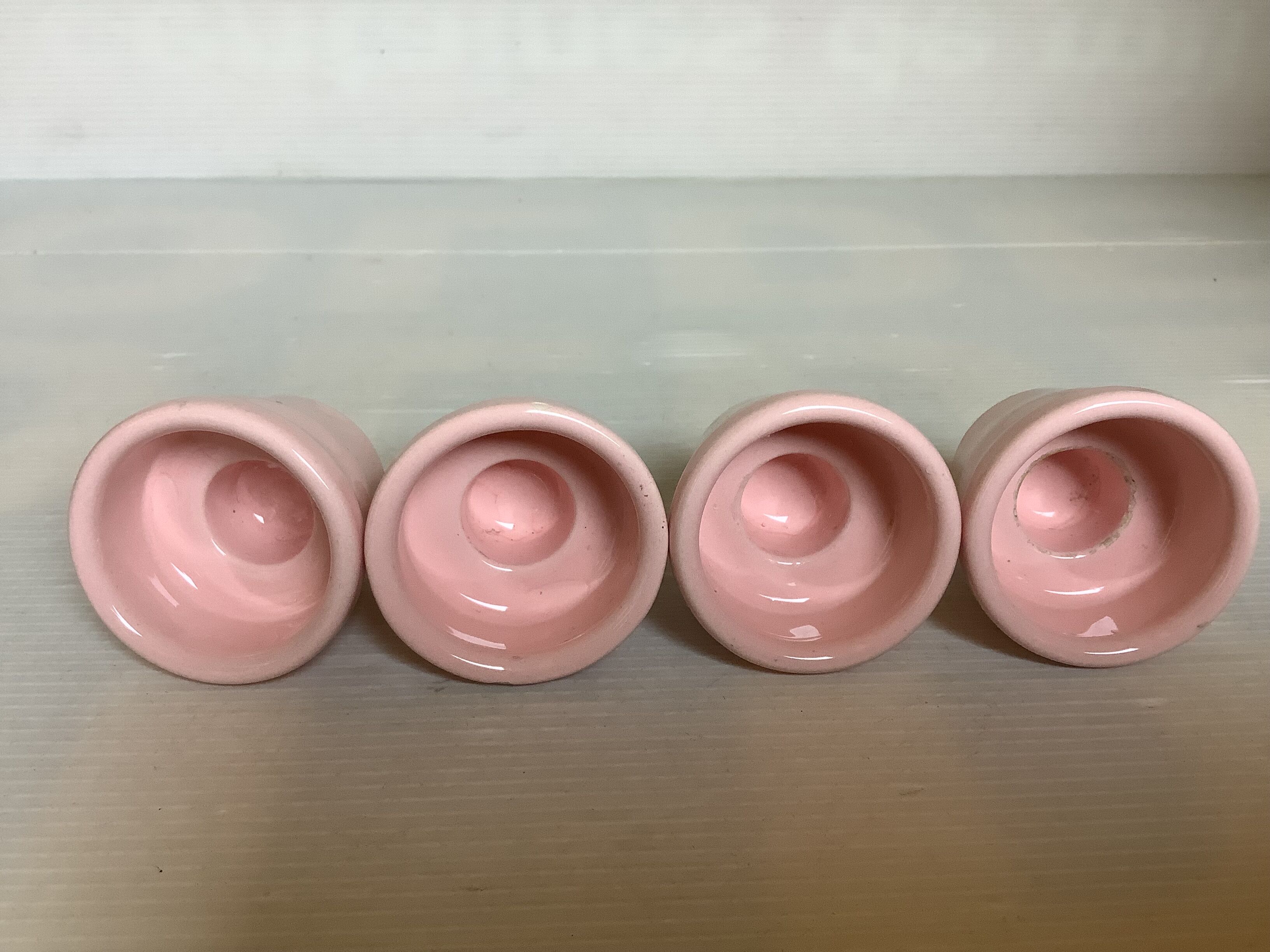 Four double pink candlesticks