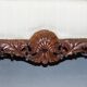 Three-seater canapé carved from solid walnut with claw feet.