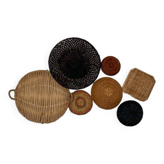 Wall composition of wicker baskets and trays.