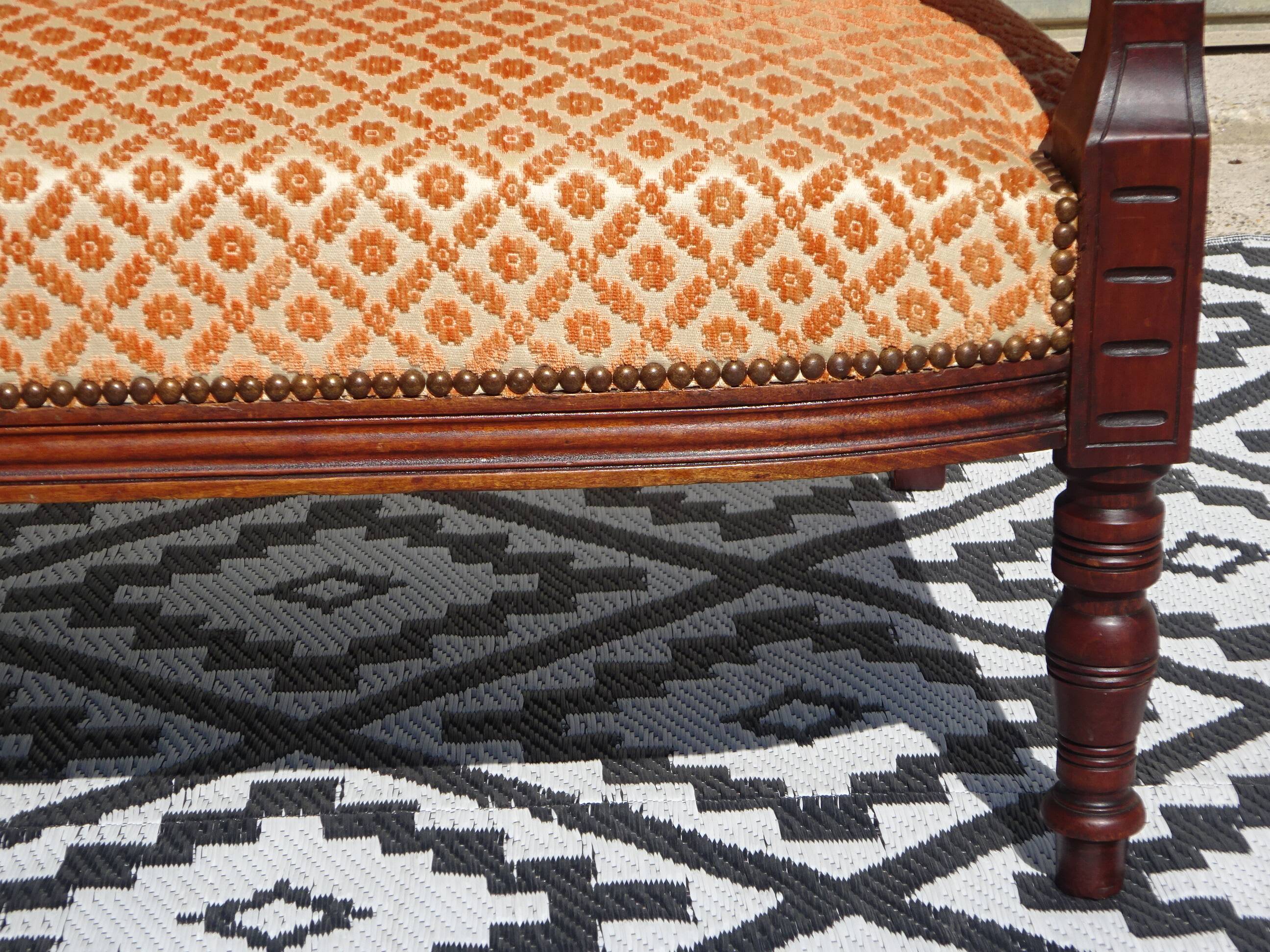 Vintage bench in wood and orange/ivory velvet.