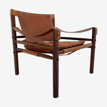 Armchair, Rosewood and cognac leather. Model "Sirocco". By Arne Norell. 1954