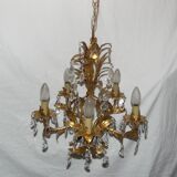Very pretty chandelier with tassels and leaves in gold sheet metal.