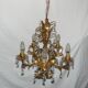 Very pretty chandelier with tassels and leaves in gold sheet metal.