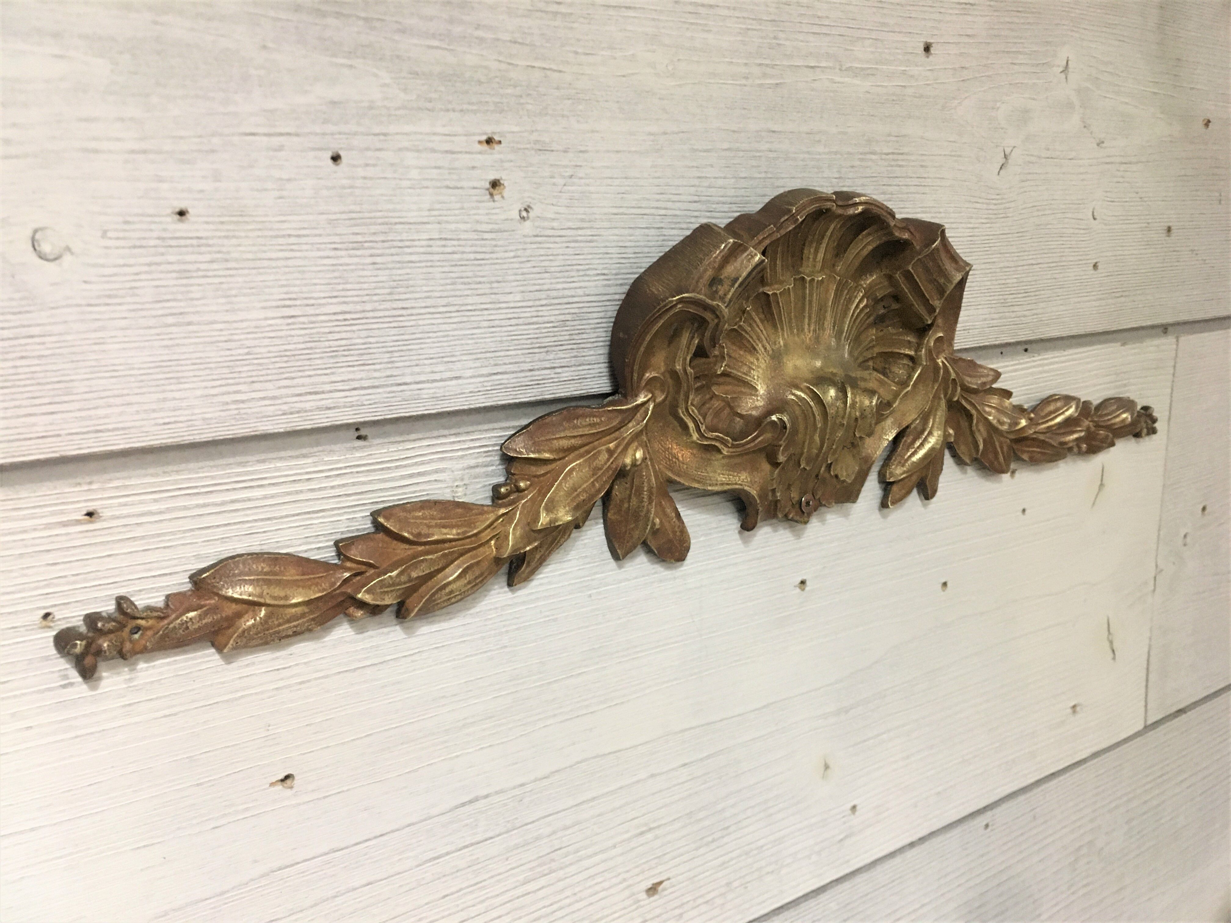 Bronze shell pediment