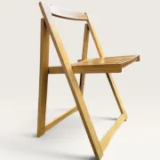 Blonde wooden folding chair in the style of Aldo Jacober.