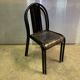 Two vintage slatted chairs.