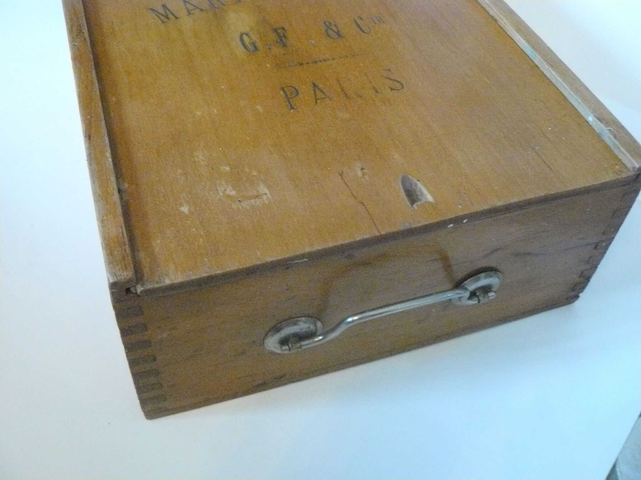 Wooden storage box marked "with a golden hammer"