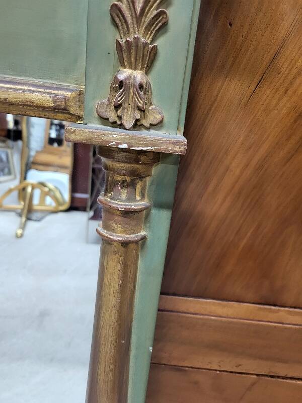 Empire style mirror in wood and gilding