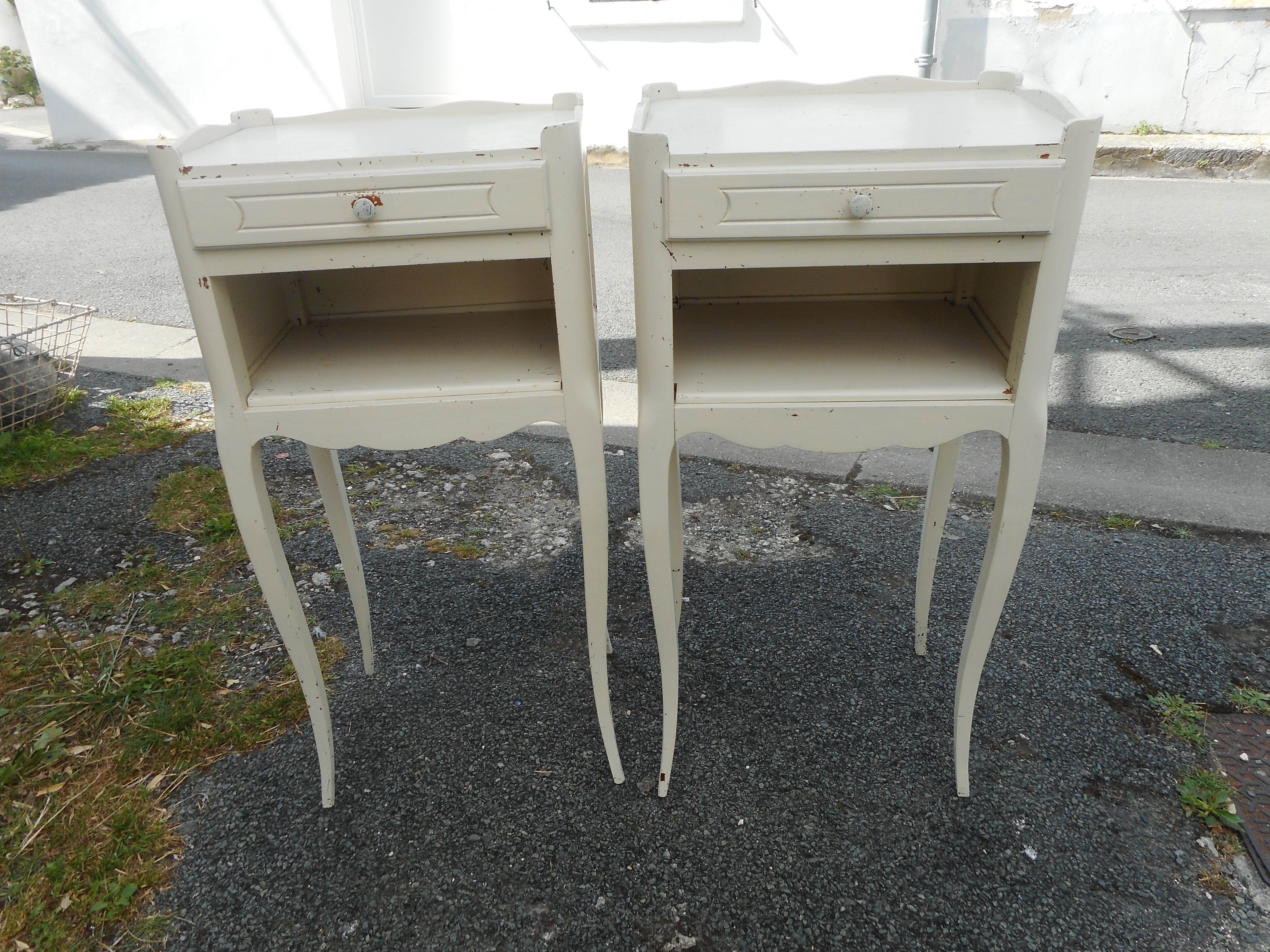 Pair of white lacquered bedside tables